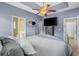 A main bedroom with a trey ceiling, ceiling fan, and ensuite bathroom at 227 Hickory Springs Ct., Conway, SC 29527
