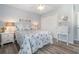 Charming bedroom with coastal decor, beach sign, and starfish quilt at 2406 S Ocean Blvd. # 301, North Myrtle Beach, SC 29582