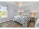 Cozy bedroom featuring a starfish-themed quilt and coastal decor at 2406 S Ocean Blvd. # 301, North Myrtle Beach, SC 29582
