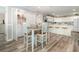 An open dining area with a 4-chair table, laundry access and kitchen view offers versatile space and functionality at 2406 S Ocean Blvd. # 301, North Myrtle Beach, SC 29582