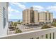 Beach condo with ocean view from balcony, overlooking street and beach access at 2406 S Ocean Blvd. # 301, North Myrtle Beach, SC 29582