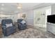 Bright living room with comfortable seating and sliding door to the patio with ocean views at 2406 S Ocean Blvd. # 301, North Myrtle Beach, SC 29582