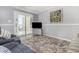 Relaxing living room featuring a balcony with scenic views, comfortable seating, and neutral tones at 2406 S Ocean Blvd. # 301, North Myrtle Beach, SC 29582