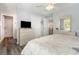 Spacious bedroom with ensuite bathroom and serene decor, offering comfort and convenience at 2406 S Ocean Blvd. # 301, North Myrtle Beach, SC 29582
