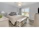 Bright main bedroom with balcony access, offering natural light and comfortable design at 2406 S Ocean Blvd. # 301, North Myrtle Beach, SC 29582