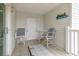 Outdoor patio with tiled floor, equipped with chairs and small table at 2406 S Ocean Blvd. # 301, North Myrtle Beach, SC 29582
