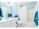 Bright bathroom featuring a white vanity, coordinated blue walls and bright white shower at 245 Egret Run Ln. # 1023, Pawleys Island, SC 29585