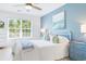 Bedroom with a white bed and plenty of natural light from a large window at 245 Egret Run Ln. # 1023, Pawleys Island, SC 29585