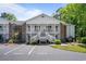 Inviting condo with brick accents, white stairs, and balconies at 245 Egret Run Ln. # 1023, Pawleys Island, SC 29585