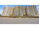 Beachfront condos with yellow balconies and sandy shoreline at 2711 Ocean Blvd. S # 915, North Myrtle Beach, SC 29582