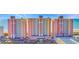 Beachfront condo building featuring pink and yellow exterior at 2711 Ocean Blvd. S # 915, North Myrtle Beach, SC 29582