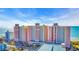 Beachfront condo building featuring pink and yellow exterior at 2711 Ocean Blvd. S # 915, North Myrtle Beach, SC 29582