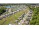 Community aerial showcasing houses, serene lakes, streets, and lush landscapes at 3019 Woodbury Ct., Conway, SC 29527