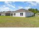 Backyard of a home showcasing the house's white exterior and inviting outdoor space at 3019 Woodbury Ct., Conway, SC 29527
