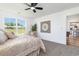 Sunlit bedroom featuring a ceiling fan, plush carpet, and large windows at 3019 Woodbury Ct., Conway, SC 29527