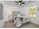 Neutral bedroom with soft carpet, fan, large window and minimalist furniture at 3019 Woodbury Ct., Conway, SC 29527