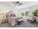 Spacious bedroom featuring a ceiling fan, plush carpet, and large windows at 3019 Woodbury Ct., Conway, SC 29527