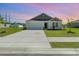 Charming single-story home with a two-car garage, tidy landscaping, and a well-maintained lawn at 3019 Woodbury Ct., Conway, SC 29527
