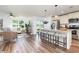 Open-concept living space with hardwood floors, bar stool seating and modern finishes at 3019 Woodbury Ct., Conway, SC 29527