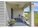 Covered back porch area with comfortable seating and serene outdoor views at 3019 Woodbury Ct., Conway, SC 29527