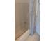 Bright bathroom featuring a white shower-tub combo with a blue and grey curtain at 302 St. Andrews Ln., Myrtle Beach, SC 29588