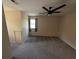 Bedroom featuring beige walls, carpeted floors, and a window with natural light, plus a black ceiling fan at 302 St. Andrews Ln., Myrtle Beach, SC 29588