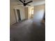 Bedroom featuring beige walls, carpeted floors, an open closet and window with natural light at 302 St. Andrews Ln., Myrtle Beach, SC 29588