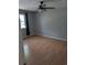 Bedroom with hardwood floor, ceiling fan, and a window at 302 St. Andrews Ln., Myrtle Beach, SC 29588