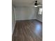 Bedroom with hardwood floors, neutral paint, and a ceiling fan fixture at 302 St. Andrews Ln., Myrtle Beach, SC 29588