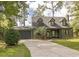 Charming two-story home with dormer windows, a spacious driveway, and attached garage at 302 St. Andrews Ln., Myrtle Beach, SC 29588
