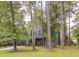 Charming home nestled among mature trees with a lush lawn and well-kept landscaping at 302 St. Andrews Ln., Myrtle Beach, SC 29588