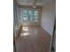 Bright sunroom features wood ceiling, multiple windows, and lovely flooring at 302 St. Andrews Ln., Myrtle Beach, SC 29588