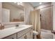 Bathroom featuring a single sink vanity with a tub and shower with tile surround at 3034 Viceroy Loop, Little River, SC 29566