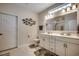 Bathroom featuring double sinks, a white vanity, and marble countertops at 3034 Viceroy Loop, Little River, SC 29566