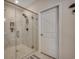 Beautifully tiled walk-in shower with glass door and a tiled niche for storage at 3034 Viceroy Loop, Little River, SC 29566