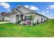 Beautifully landscaped lawn with decorative turtle and stone accent pieces at 3034 Viceroy Loop, Little River, SC 29566