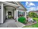Inviting front porch with decorative landscaping and a well-manicured lawn at 3034 Viceroy Loop, Little River, SC 29566