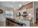 Spacious kitchen with granite countertops, pendant lighting, and seating at the large island at 3034 Viceroy Loop, Little River, SC 29566