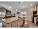 Open kitchen with granite countertops, stainless steel appliances, and a view to the living area at 3034 Viceroy Loop, Little River, SC 29566