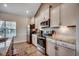Bright kitchen featuring stainless steel appliances, granite countertops, and light wood flooring at 3034 Viceroy Loop, Little River, SC 29566