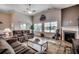 Spacious living room featuring a fireplace, high ceilings, and lots of natural light at 3034 Viceroy Loop, Little River, SC 29566