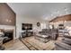 Open-concept living room with fireplace and an adjacent kitchen at 3034 Viceroy Loop, Little River, SC 29566
