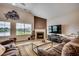 Cozy living room with fireplace, large windows, and comfortable seating at 3034 Viceroy Loop, Little River, SC 29566