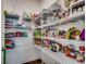 Pantry features white wire shelves stocked with many food items at 3034 Viceroy Loop, Little River, SC 29566