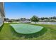 Community putting green with flags, situated near a pond at 3034 Viceroy Loop, Little River, SC 29566