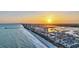 Gorgeous aerial view of the shoreline at sunset with ocean, beach, and buildings at 308 44Th Ave. N, North Myrtle Beach, SC 29582