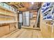 Basement storage with shelving, a refrigerator, and plywood walls and ceiling at 308 44Th Ave. N, North Myrtle Beach, SC 29582