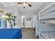 Bright bedroom boasts a bunk bed, a dresser with a television, and ample closet space at 308 44Th Ave. N, North Myrtle Beach, SC 29582