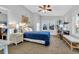 Bright bedroom featuring a blue-covered bed, wicker furnishings, and a ceiling fan at 308 44Th Ave. N, North Myrtle Beach, SC 29582