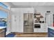Bright kitchen features stainless refrigerator and white cabinets for a clean and modern design at 308 44Th Ave. N, North Myrtle Beach, SC 29582